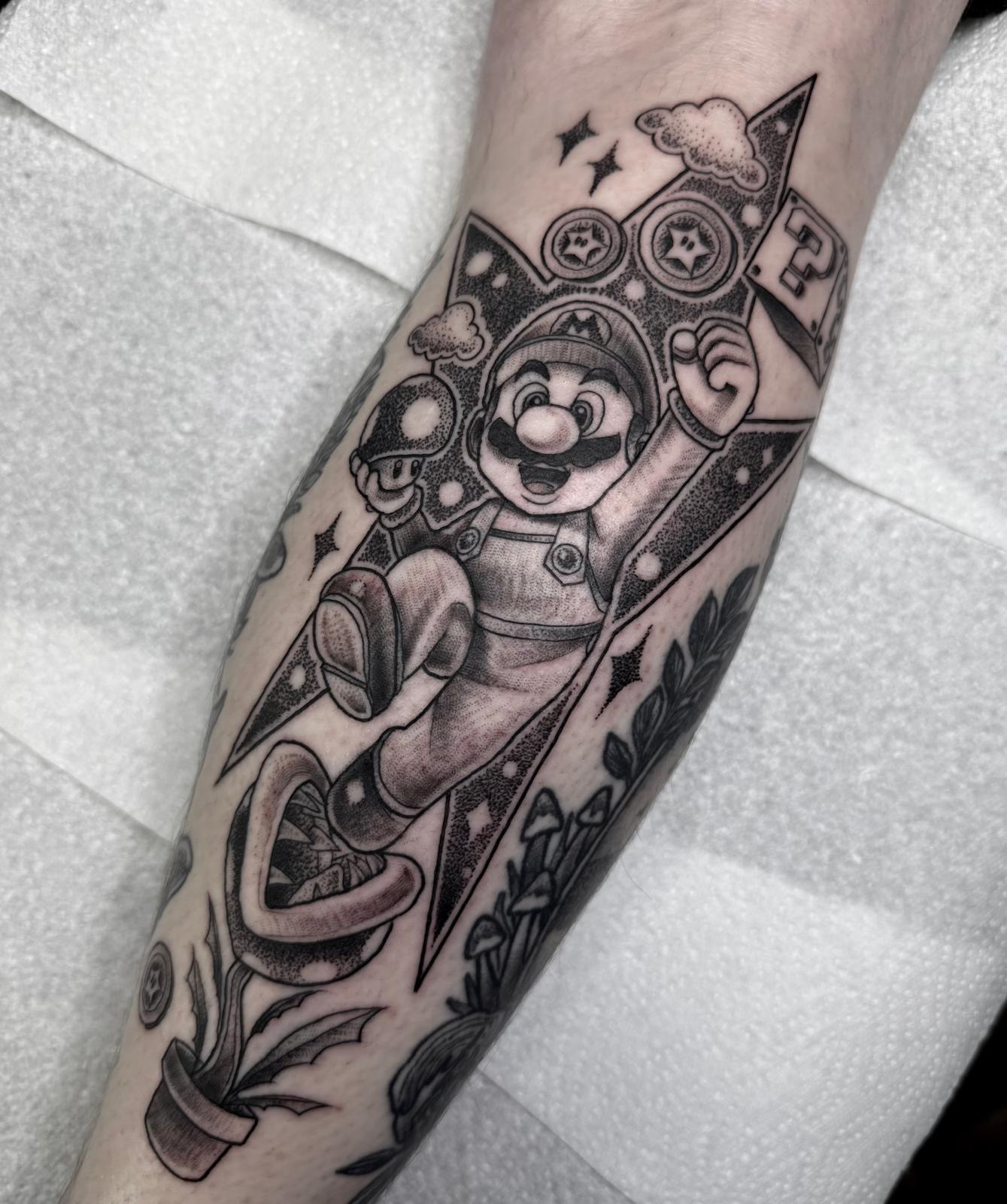 Mario calf tattoo